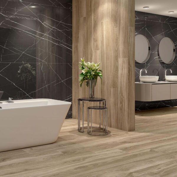 Modern bathroom showroom with white freestanding tub, wooden pillar, and black marble walls with white veining.
