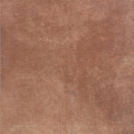Close-up of a reddish-brown, rough, rust-like textured surface.
