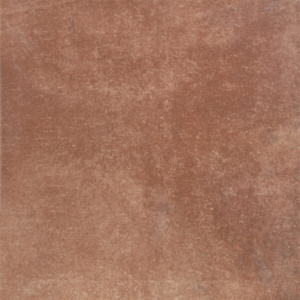 Close-up of a reddish-brown, rough, rust-like textured surface.