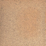 Close-up of a rough, speckled orange-brown rusty metal surface.
