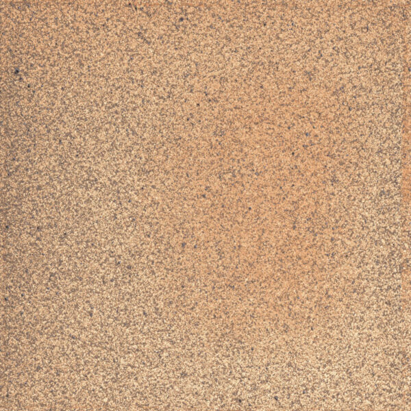 Close-up of a rough, speckled orange-brown rusty metal surface.
