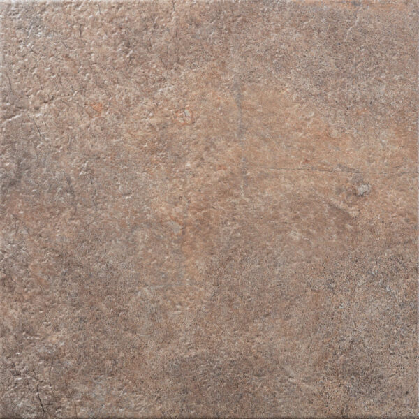 Close-up of a rough, weathered brown stone surface with cracks and a reddish patina.