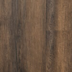 Close-up of dark brown wood floor planks with grain patterns and seams.