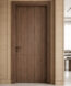 Dark wood interior door set in a light wood-paneled hallway, with a living room and sofa visible through the right doorway behind a partial wall.