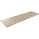 Long beige rectangular stone tile or slab, shown at an angle with a beveled edge on the left.